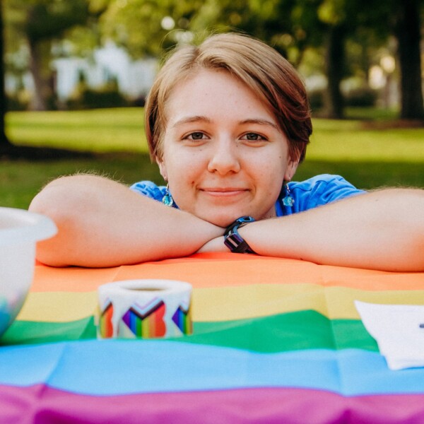 student leaning on table