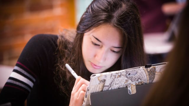 girl using tablet with stylus