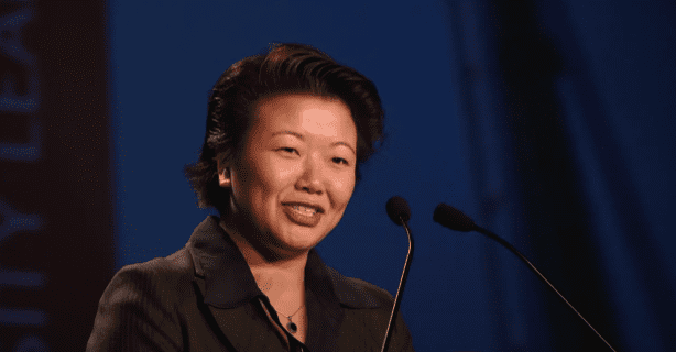 woman speaking at podium