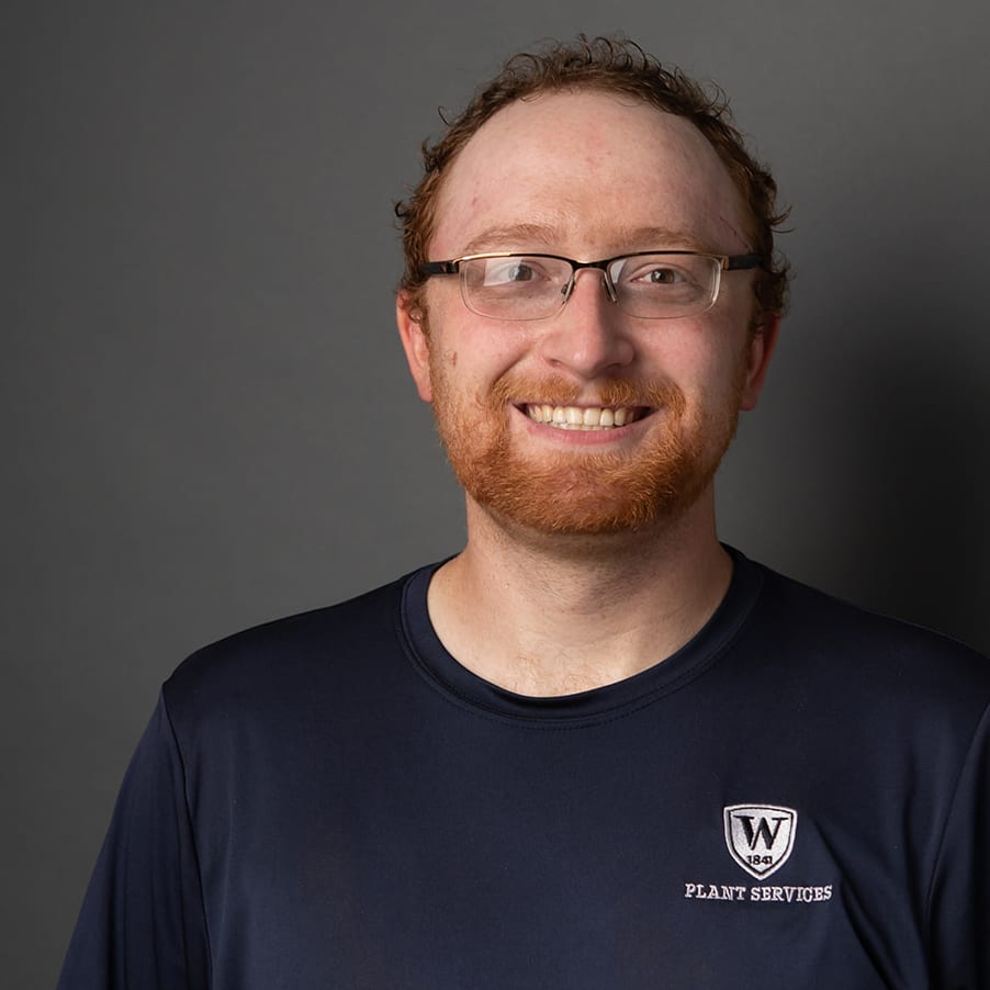man with beard and glasses smiling