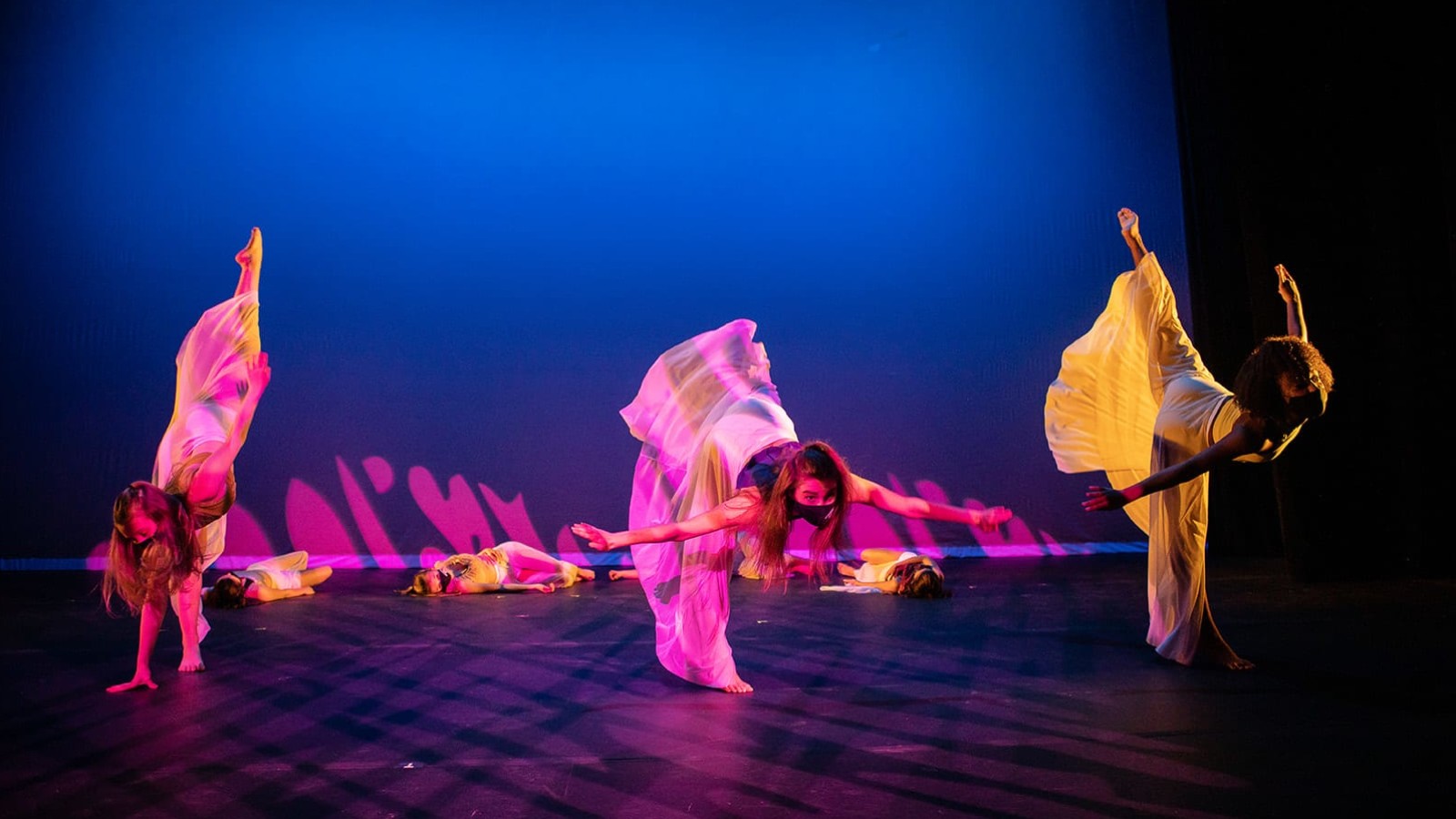 Dancers on blue background