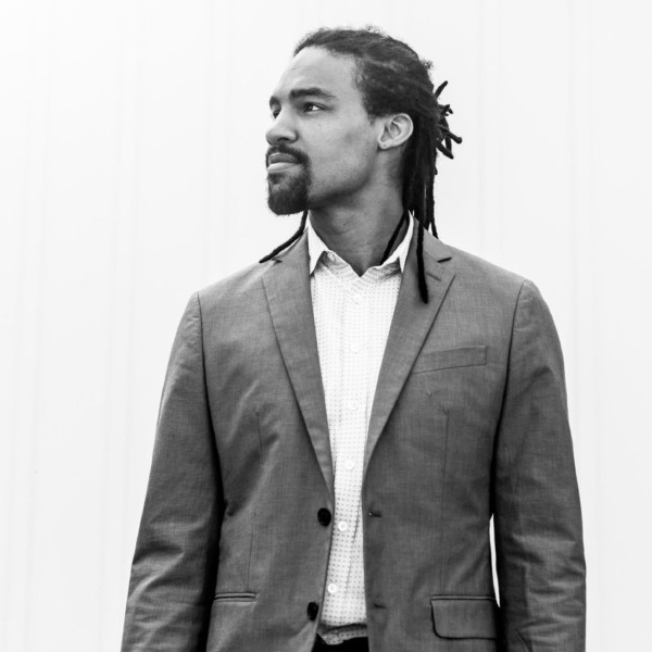 man in blazer standing outside