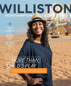 Magazine cover with woman in hat on beach