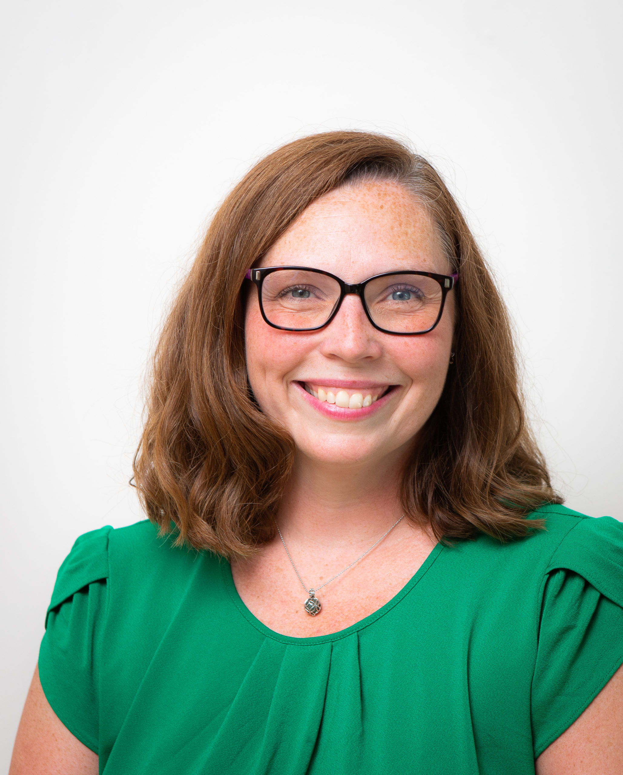 Woman with glasses smiling