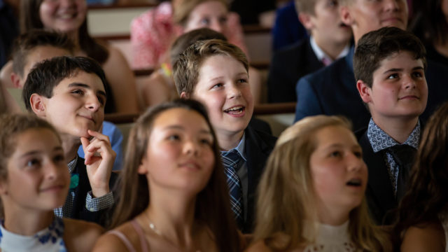 students dressed up in a chapel