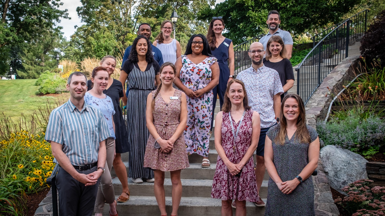 14 people standing on steps