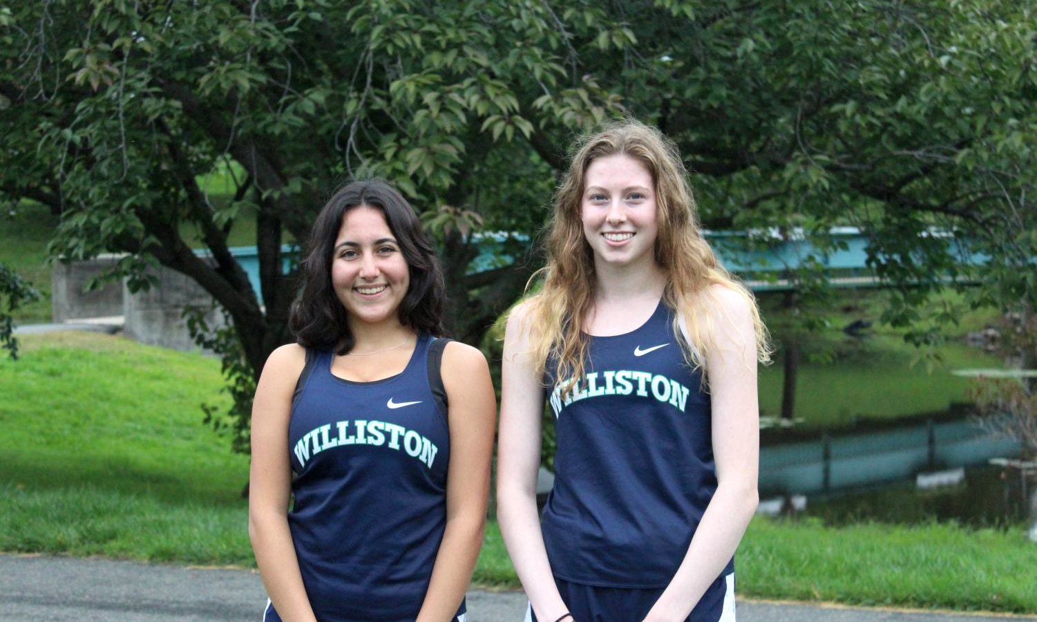 two girls in sports uniforms