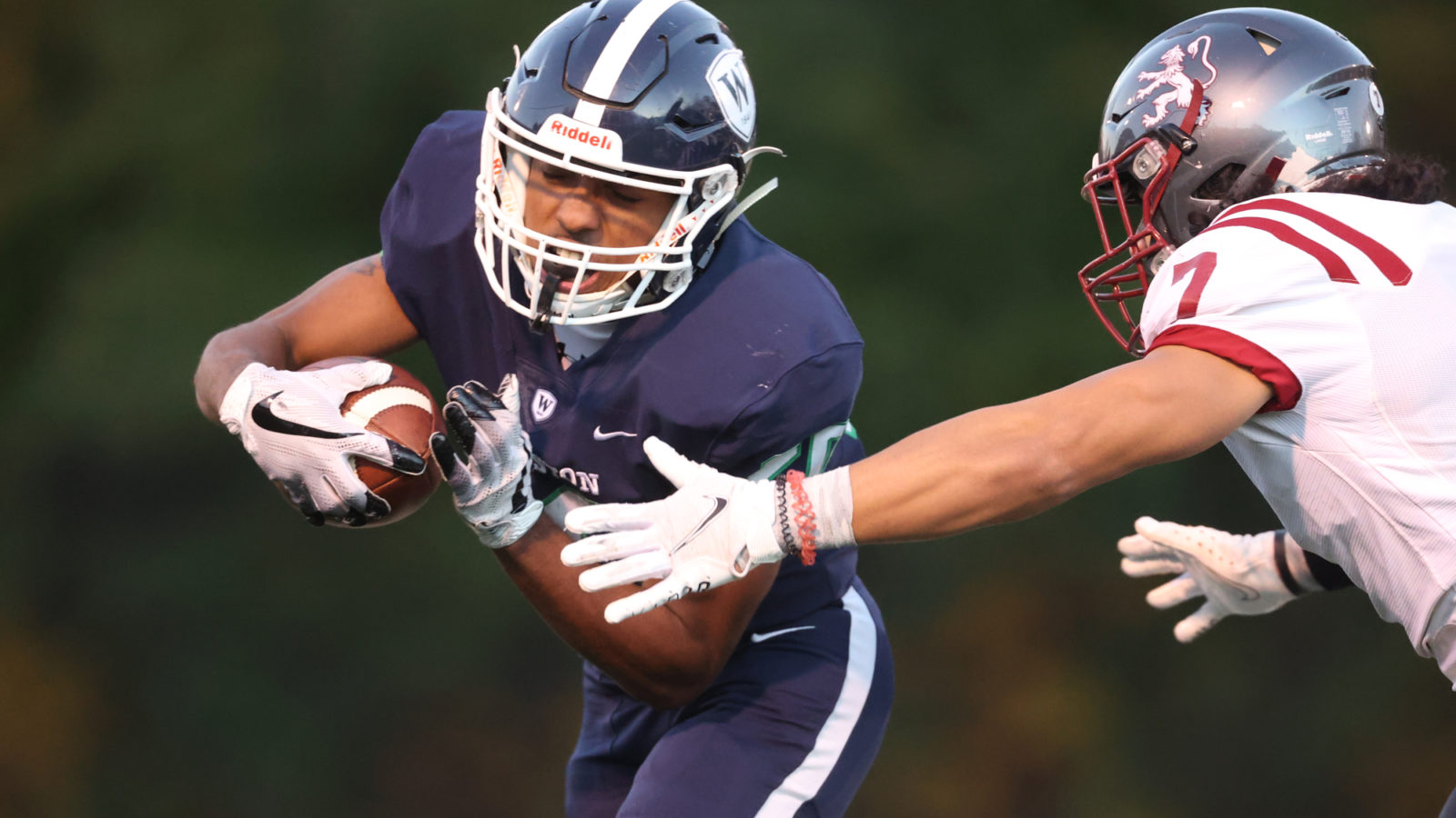 football player runs with ball