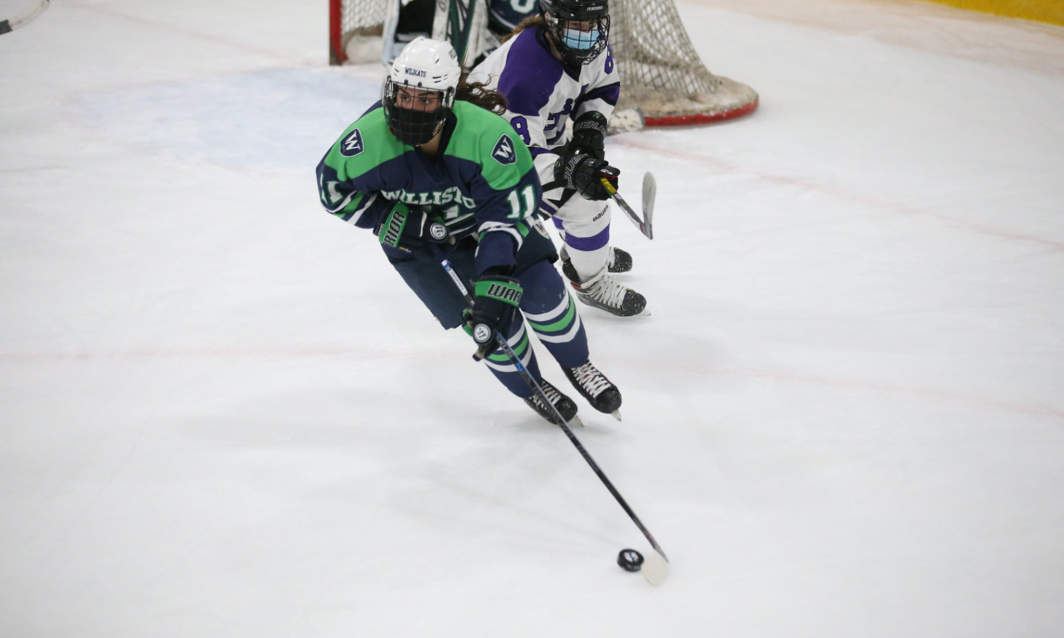 girl playing hockey