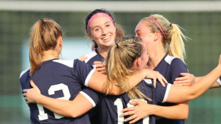 girl soccer players celebrate