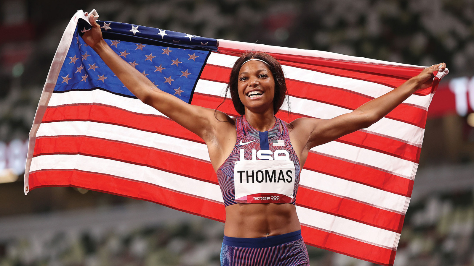 olympic runner with American flag