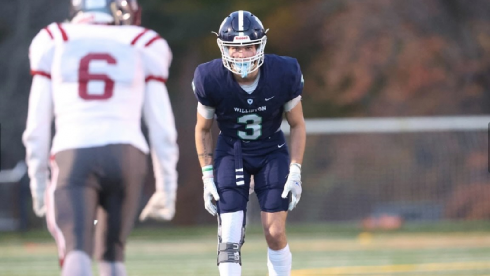 football player facing off with opposition