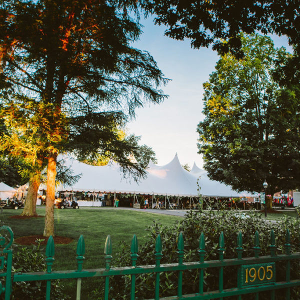 large white event tent on lawn