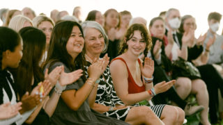 people clapping at event