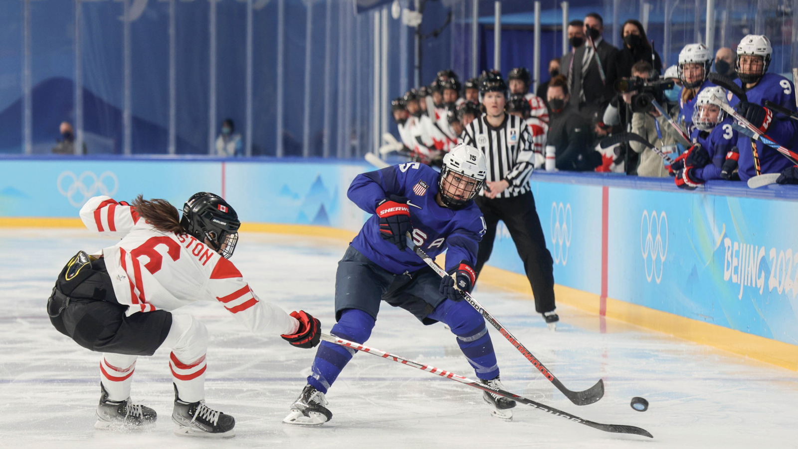 hockey players and ref at Tokyo Olympics