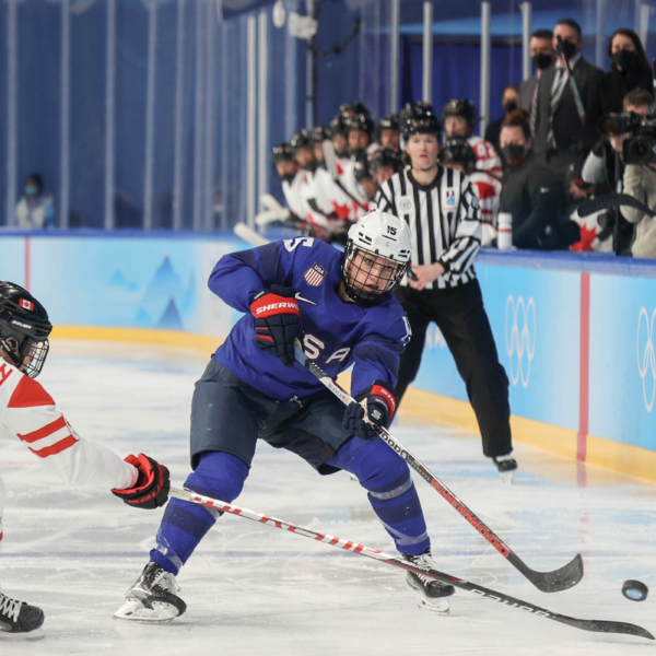 hockey players and ref at Tokyo Olympics