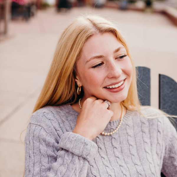 young woman in adirondack chair
