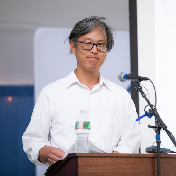 Ken Choo speaking at 2020 reunion man at podium