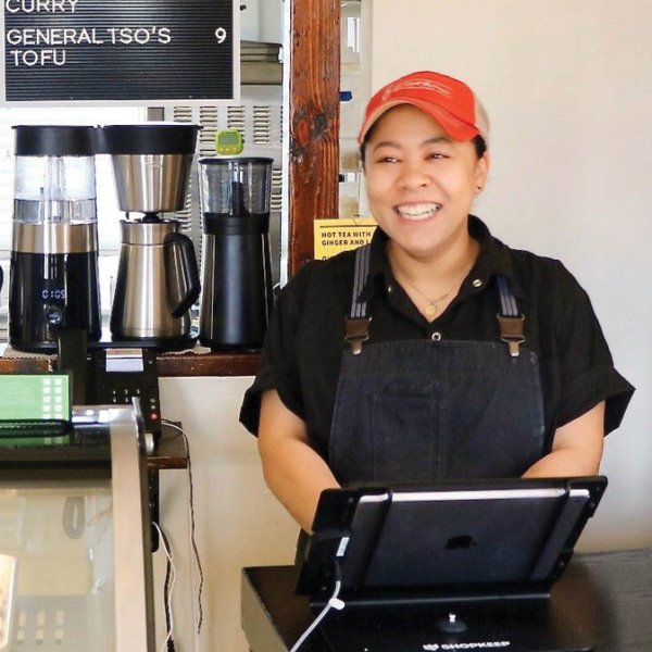 woman behind restaurant counter