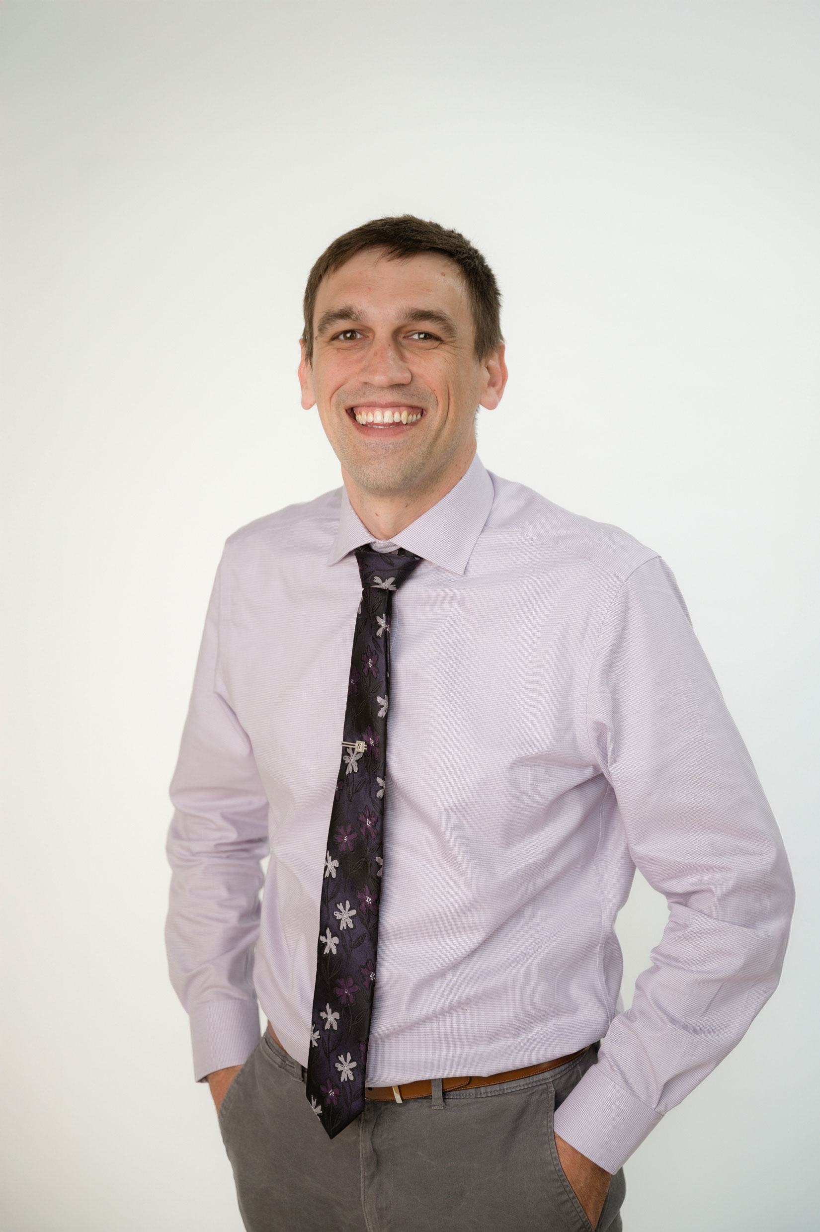 man wearing tie smiling
