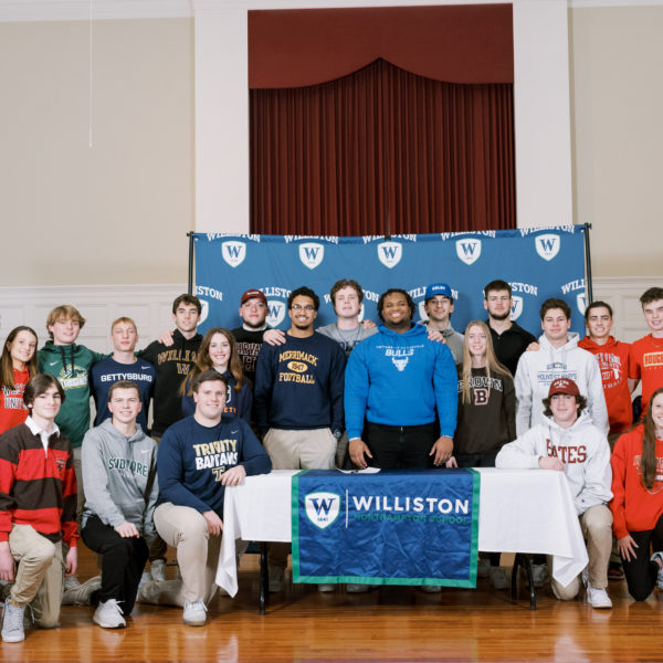 boys, girls williston students stand in chapel for athletic signing ceremony