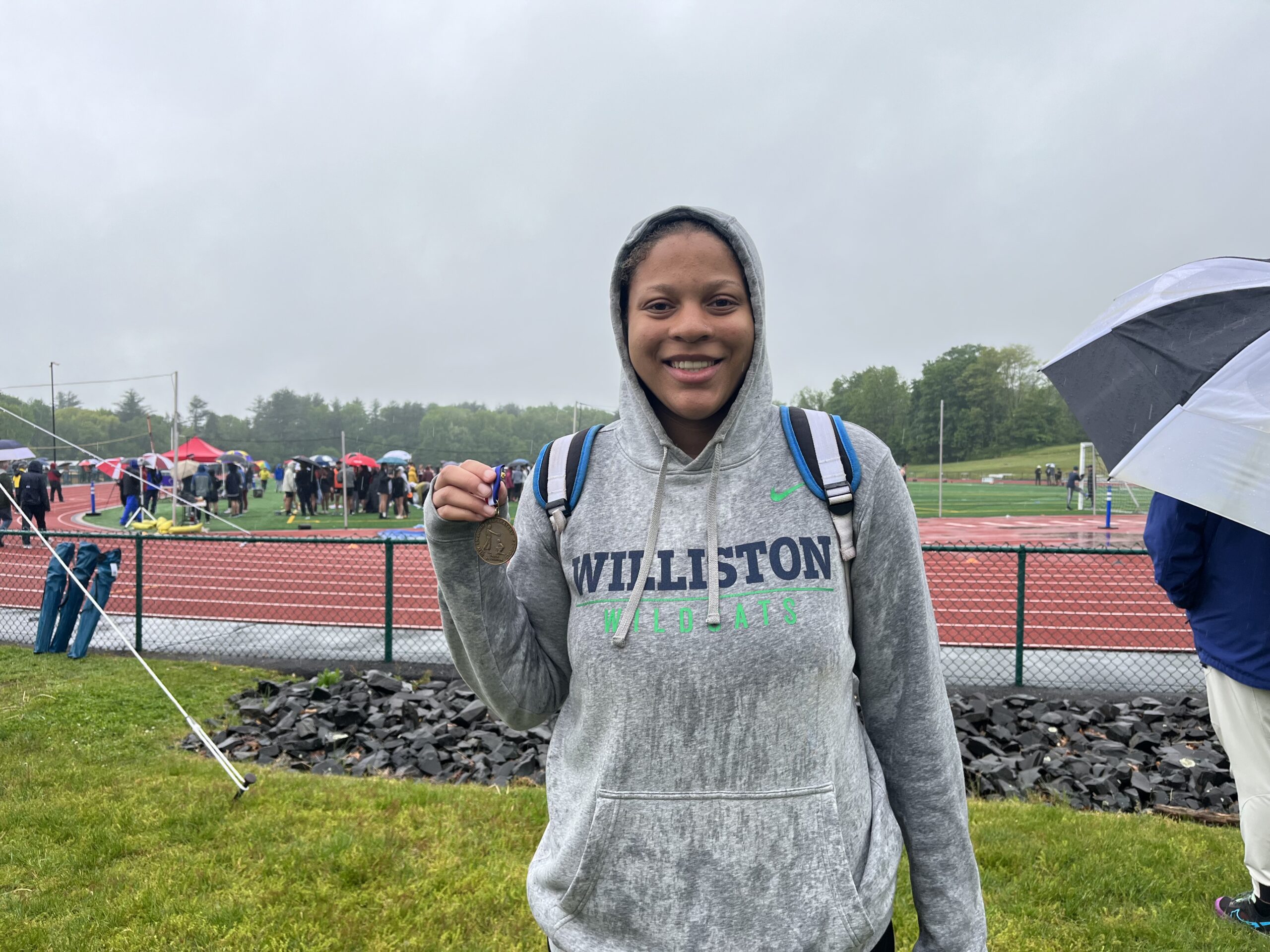 Jurnee Jones '23 poses with gold medal after NEPSTA DII championships