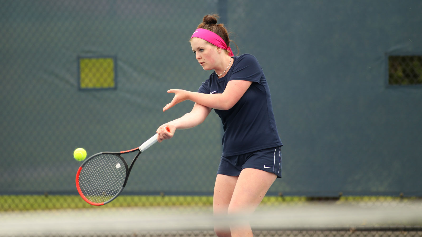 girl playing tennis