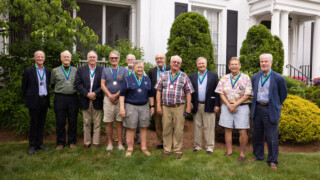 11 members of 1967 Boys Soccer Team pose for picture