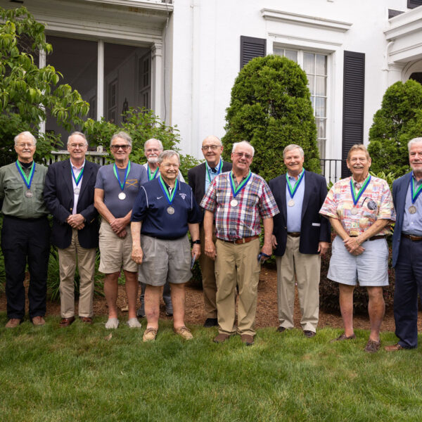 11 members of 1967 Boys Soccer Team pose for picture