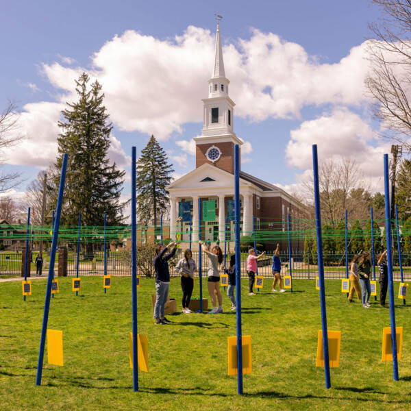 students on quad doing project