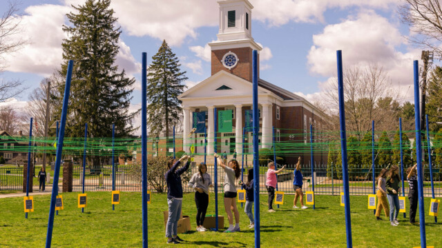 students on quad doing project