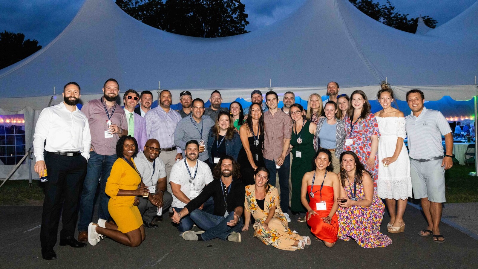 Group of people in front of tent at night