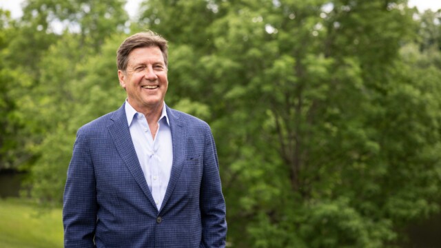 man smiling and posing