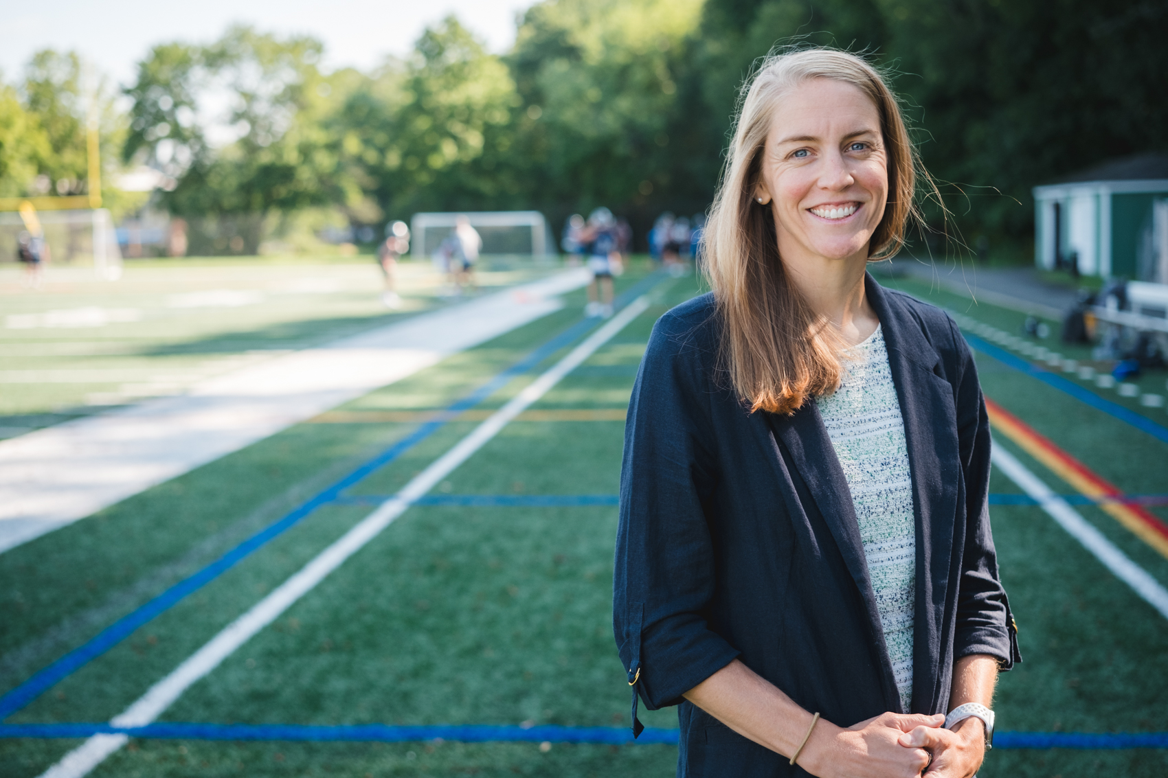 woman standing on athletic field