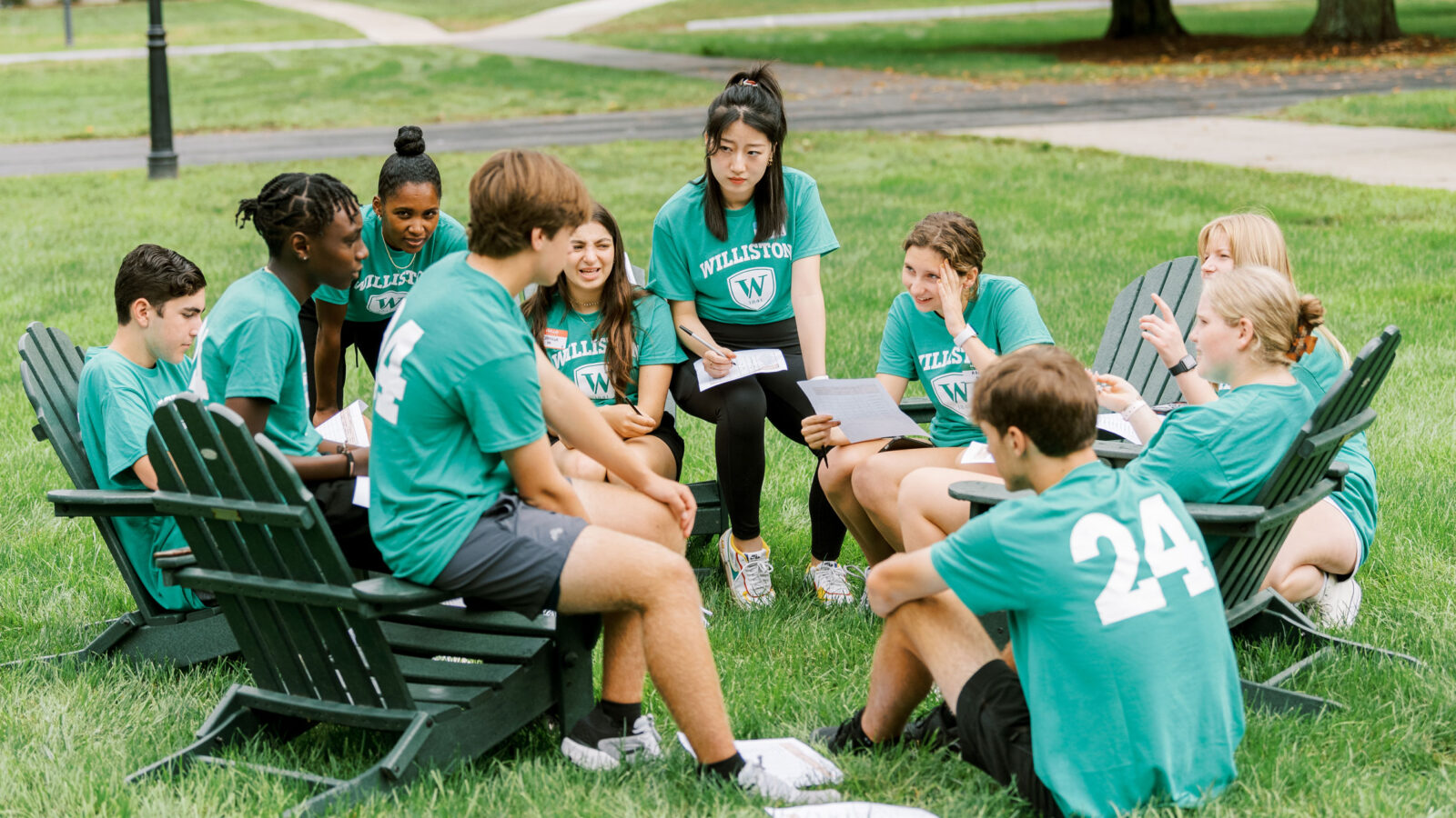 students in chairs on quad
