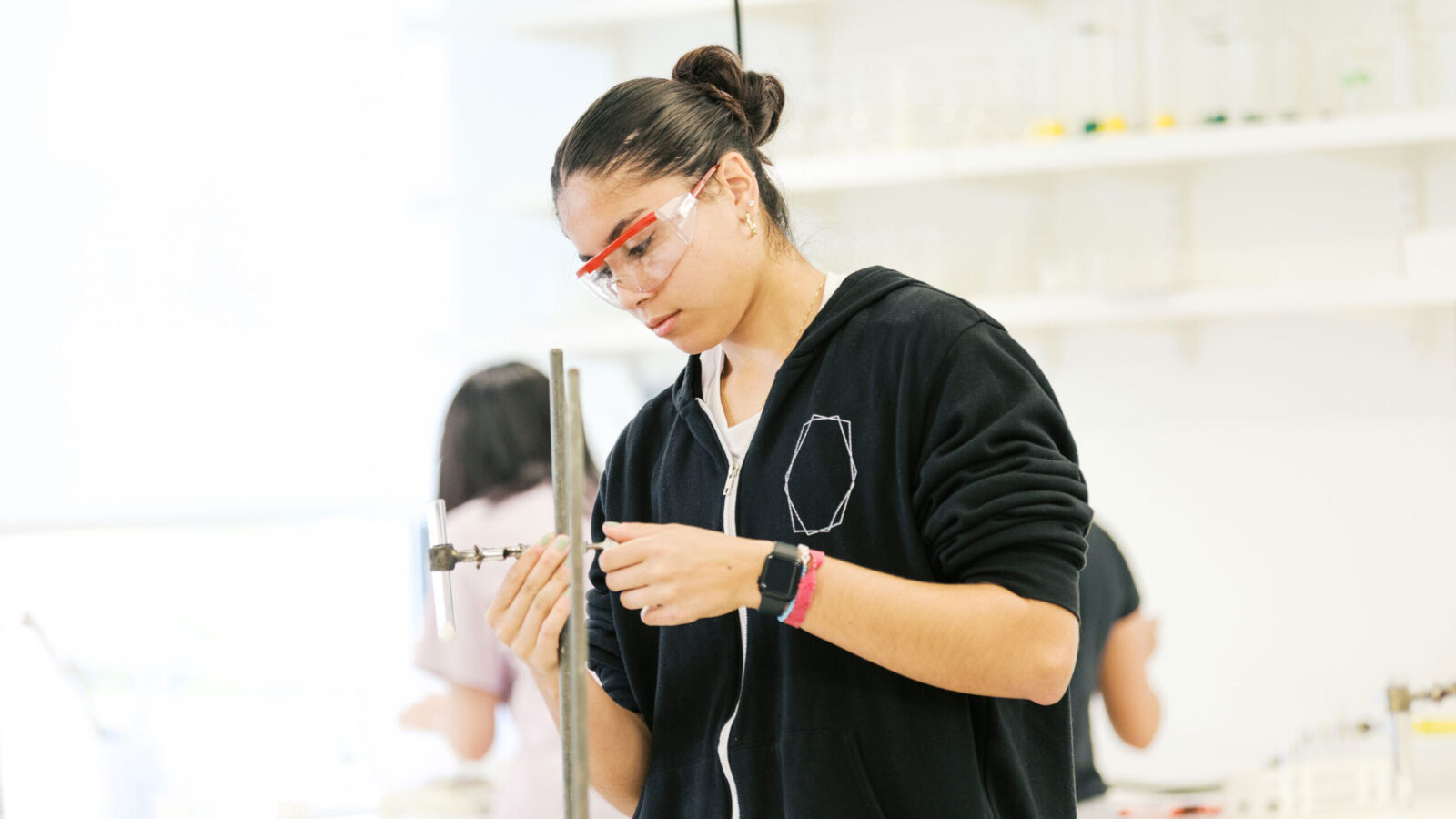 student in science class