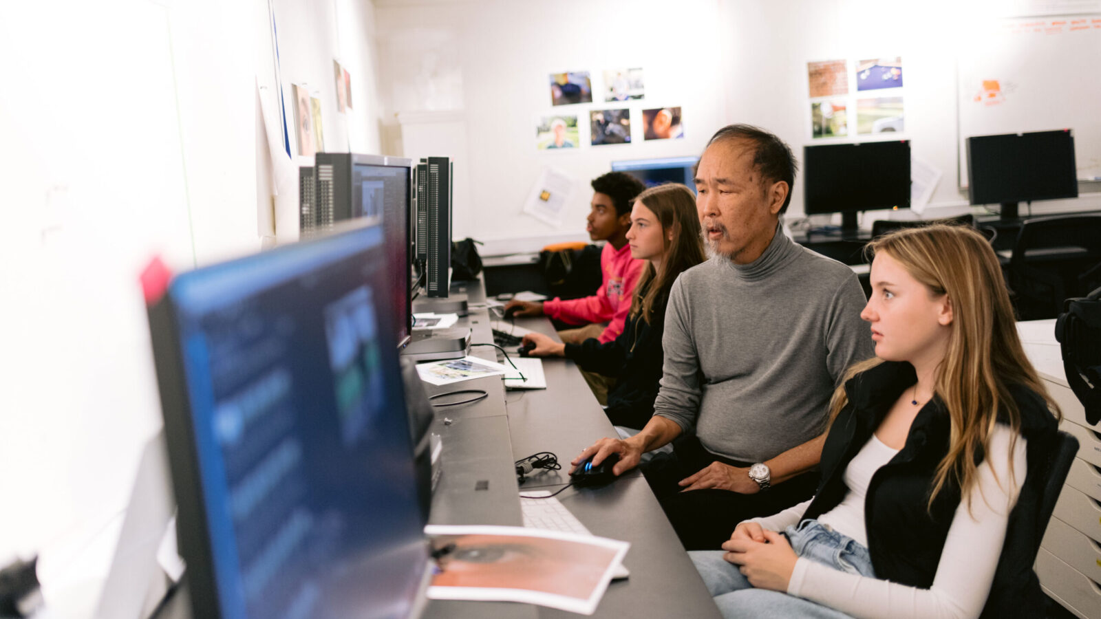 teacher and student at computer