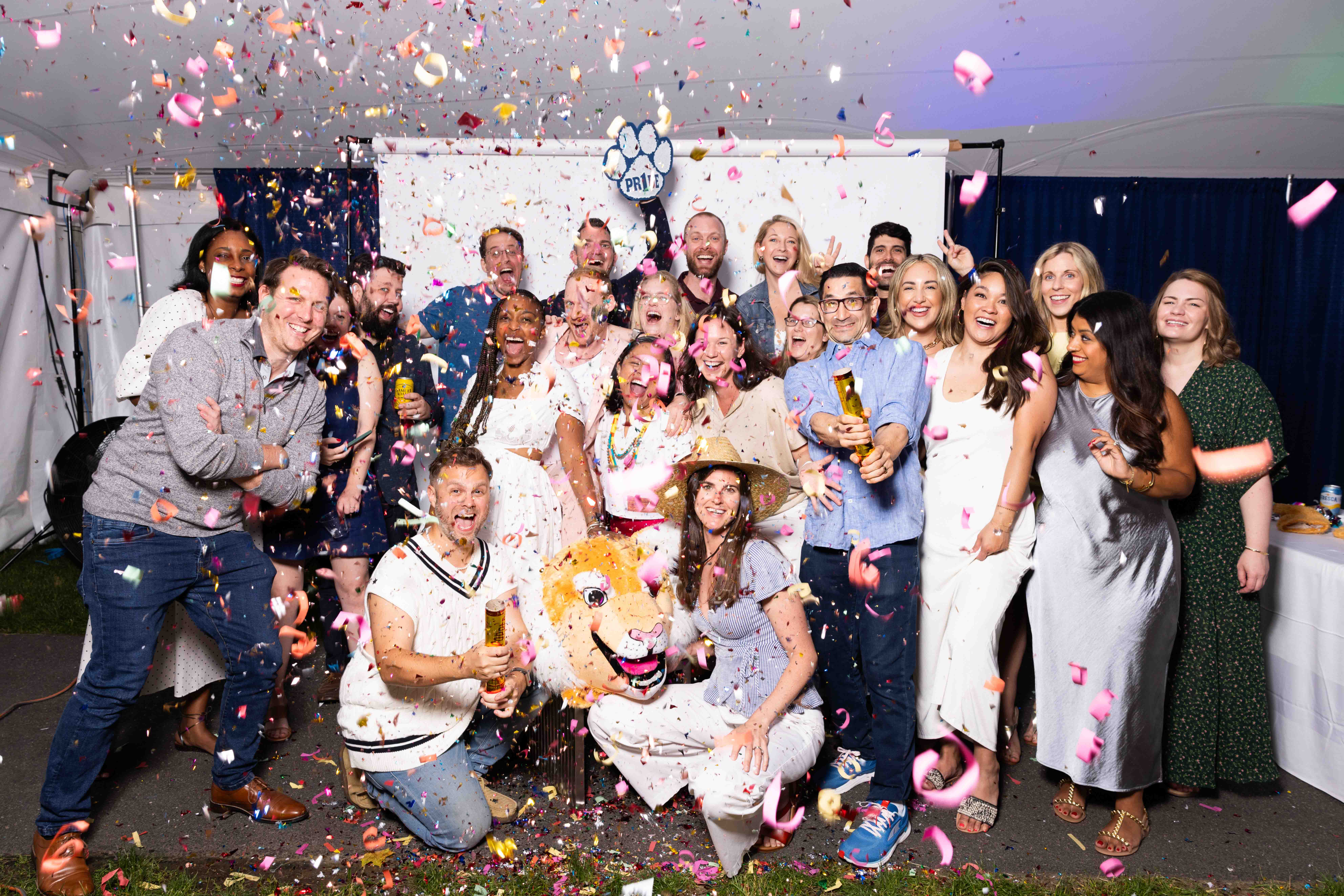Group of alumni celebrating with confetti