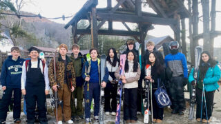 Twelve Williston students pose for picture at Berkshire East with their skis