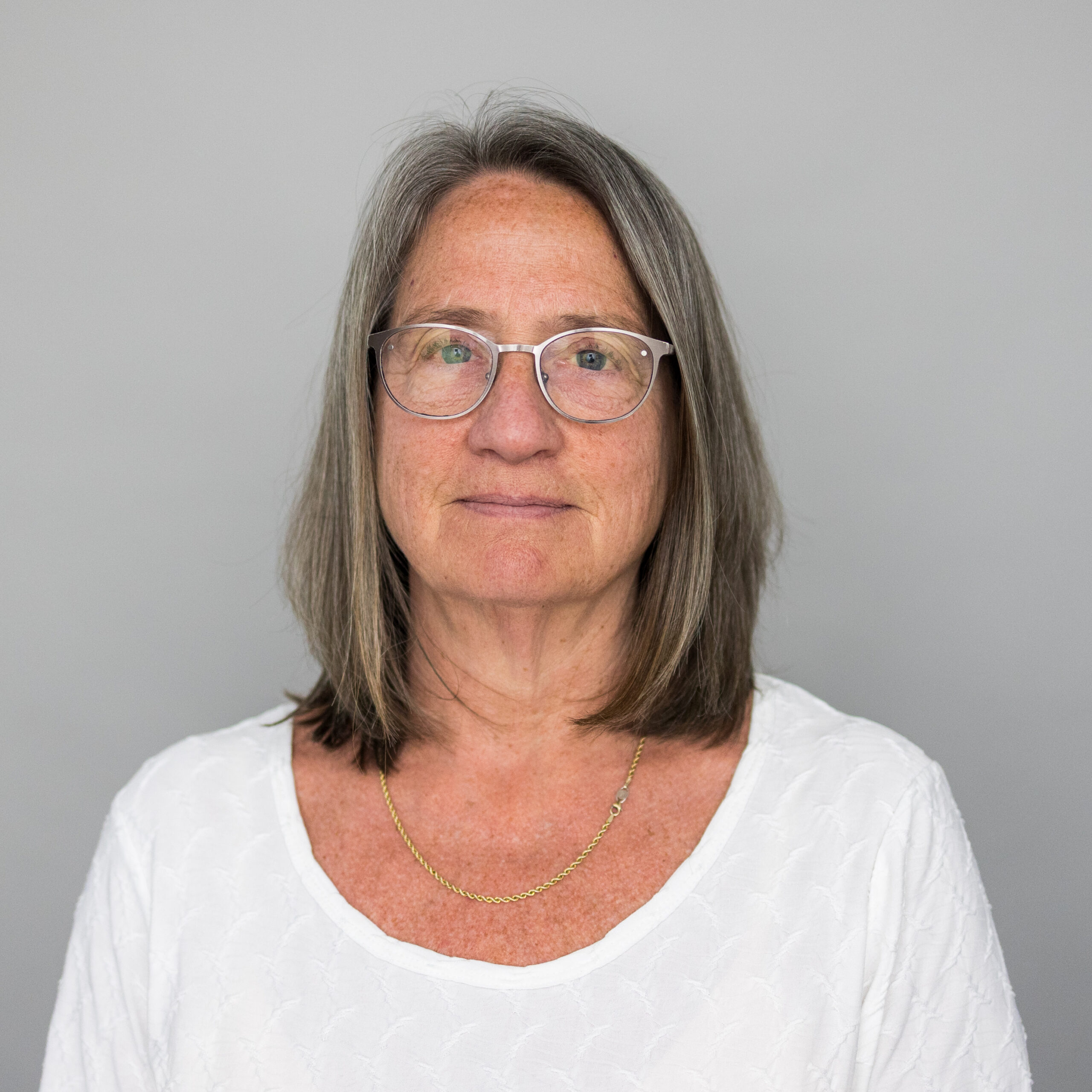 woman in white on gray