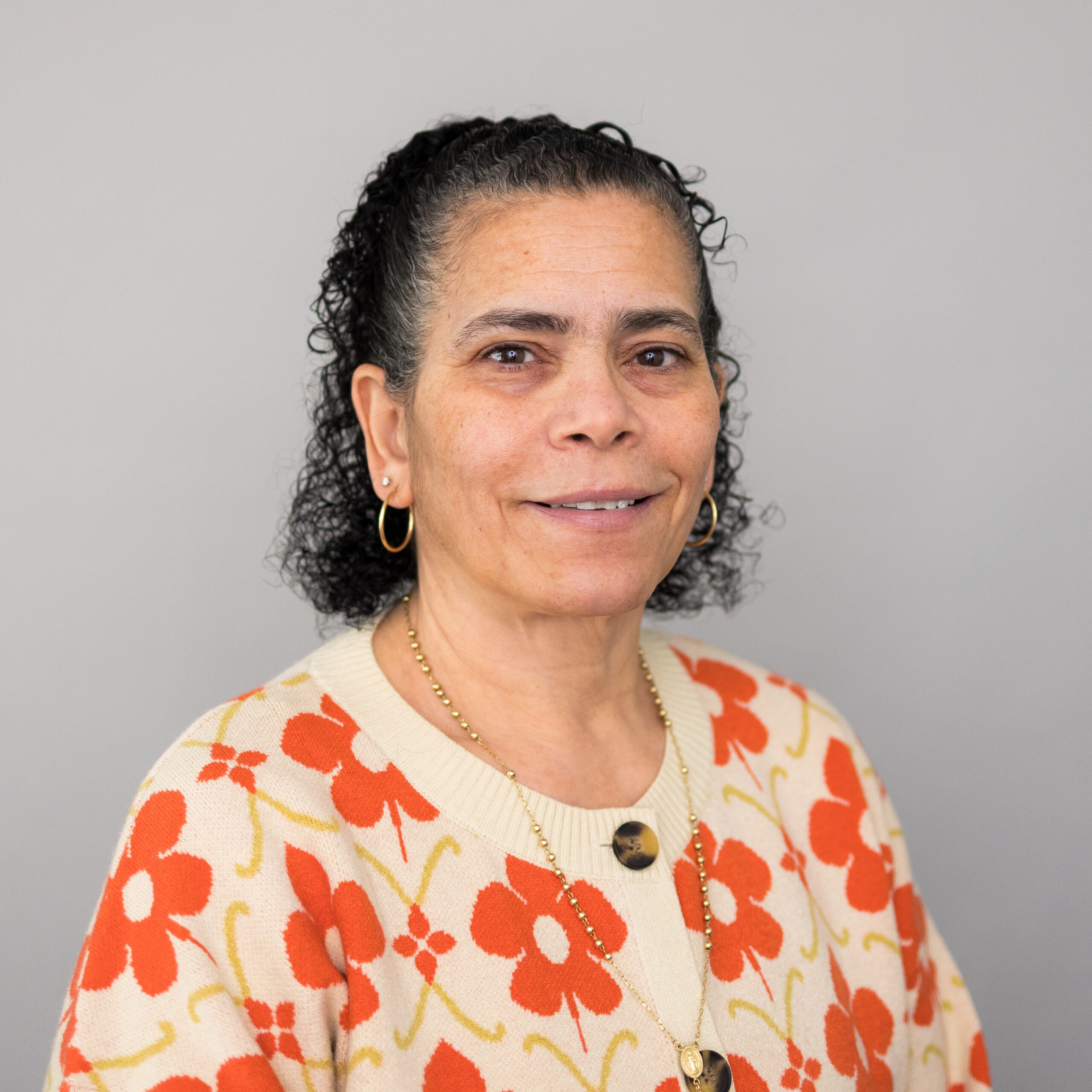 woman in floral sweater