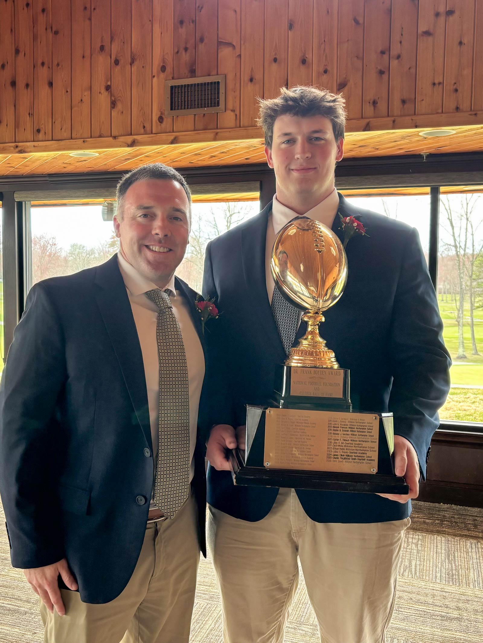 Tom Beaton and Chris Oswitt '26 pose with Boyden Award Trophy