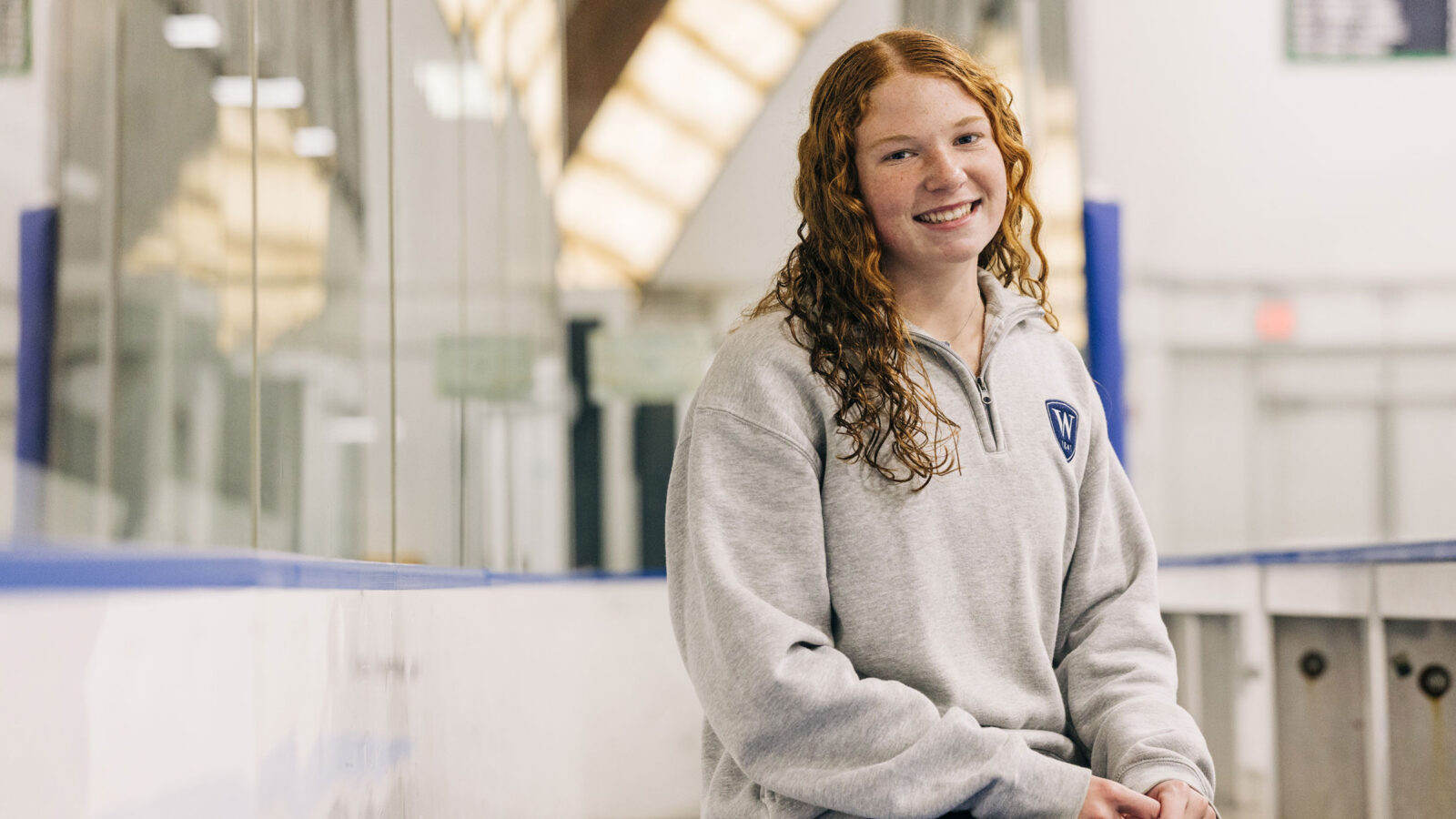 Female student athlete in hockey rink
