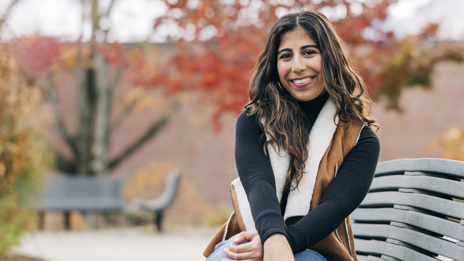 Female student sitting on bench