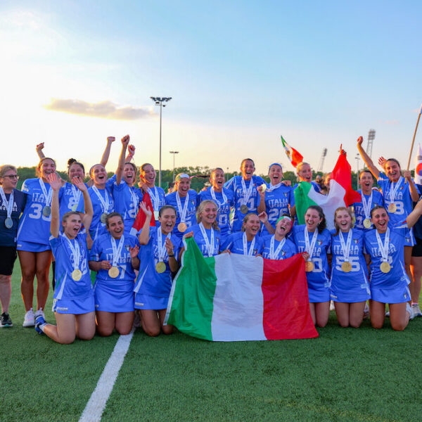 Girls lacrosse players celebrate winning game