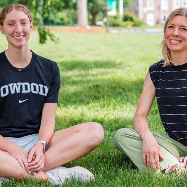 Williston student and counselor sit on Academic Quad