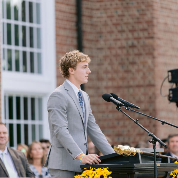 Student speaks at microphone
