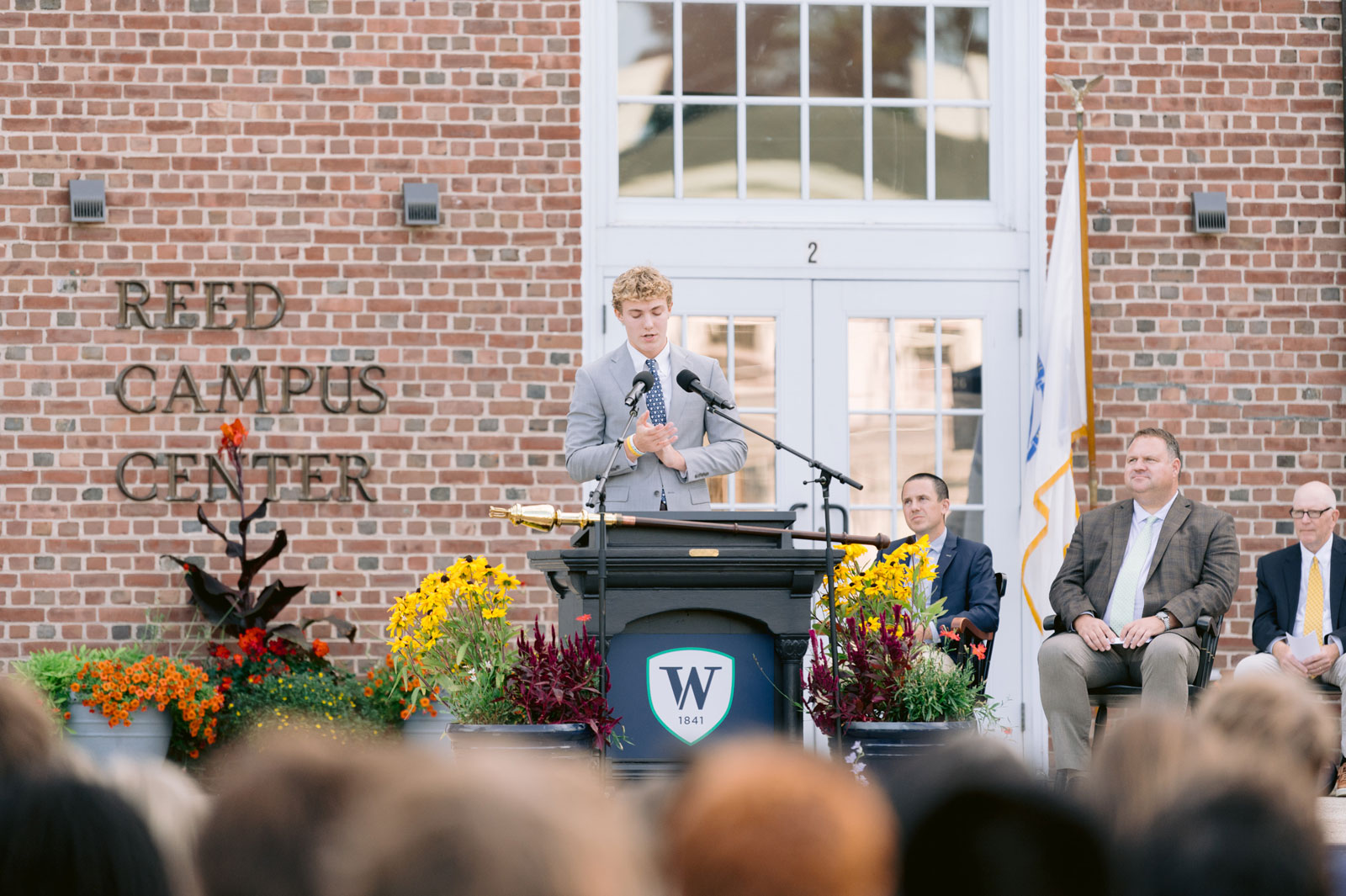 Student speaks at microphone
