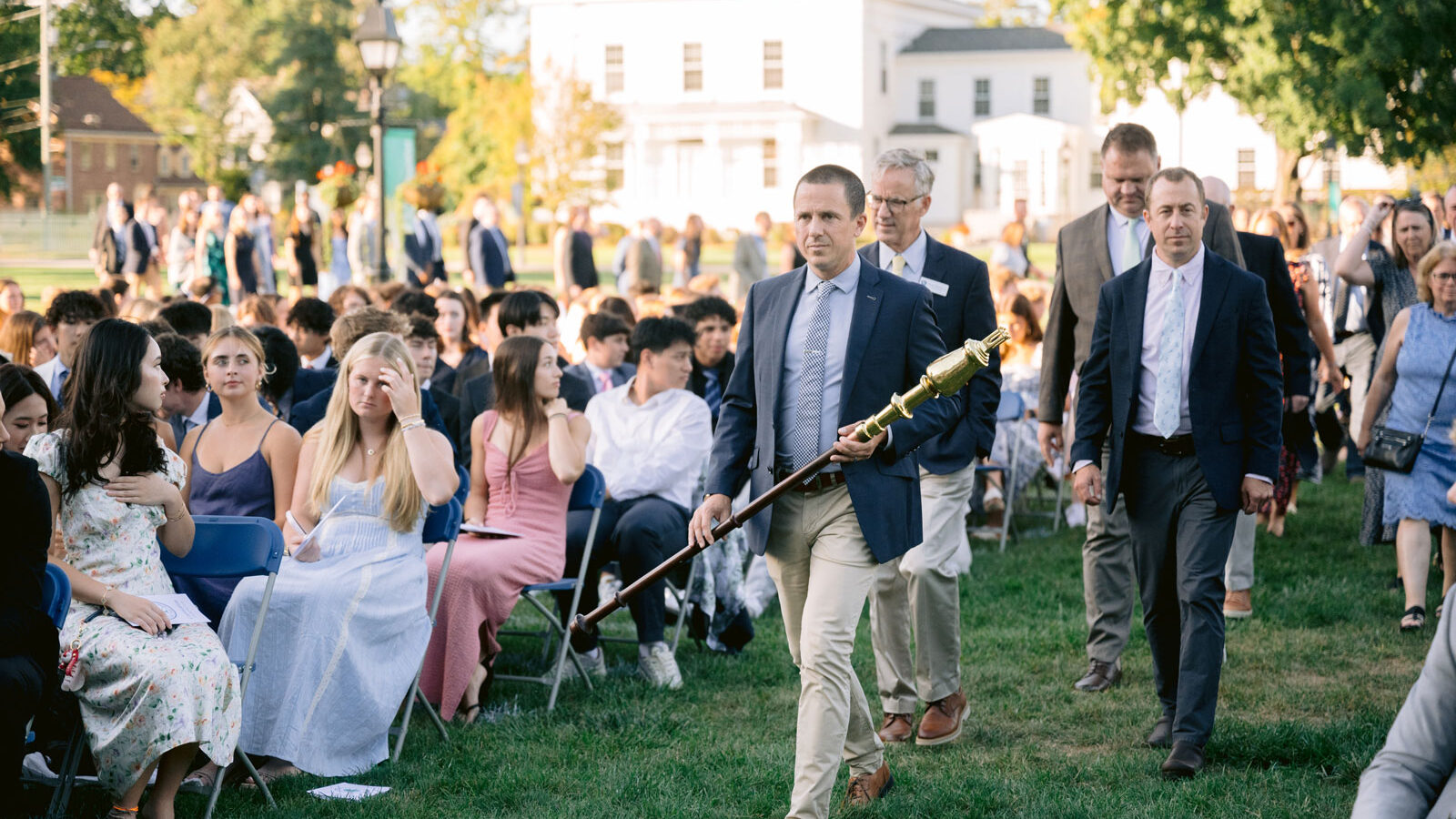 Faculty members walk down aisle during Convocation ceremony
