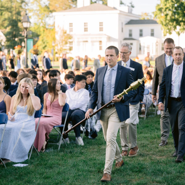 Faculty members walk down aisle during Convocation ceremony